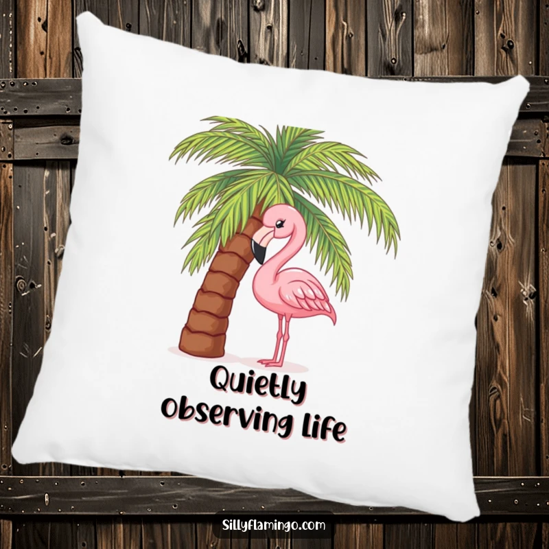 Funny decorative pillow featuring a pink flamingo curiously peeking out from behind a palm tree, adding a touch of tropical whimsy.