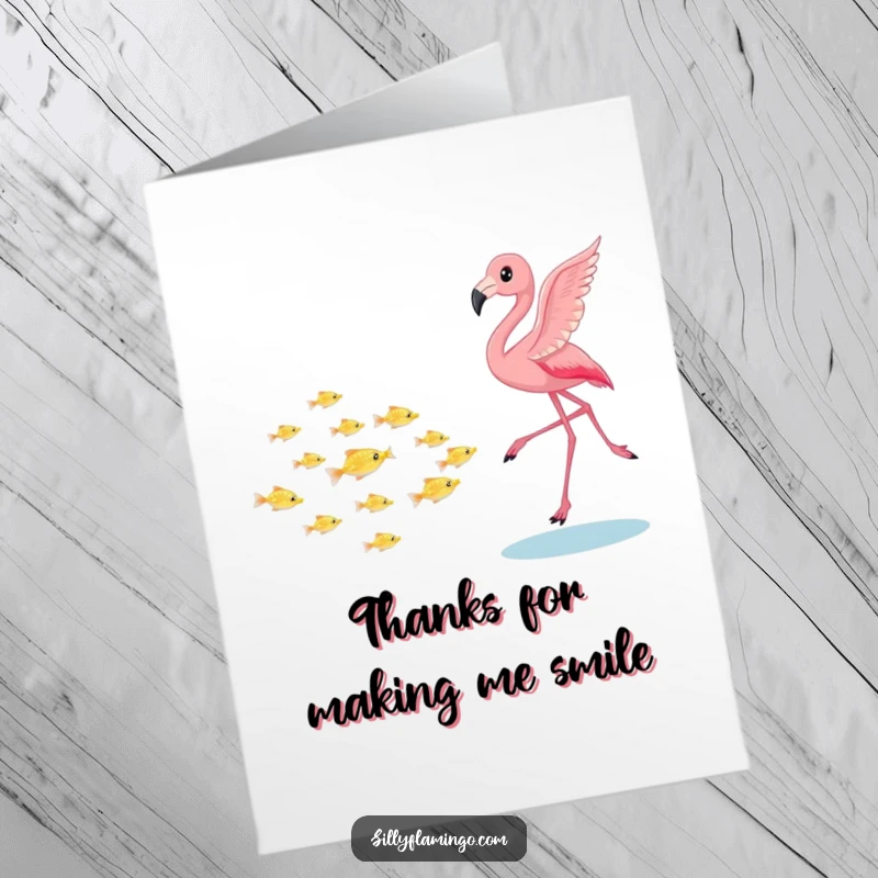Funny Free Printable Thank You Card: A pink flamingo playfully chasing tiny shimmering fish, a gesture of thanks.