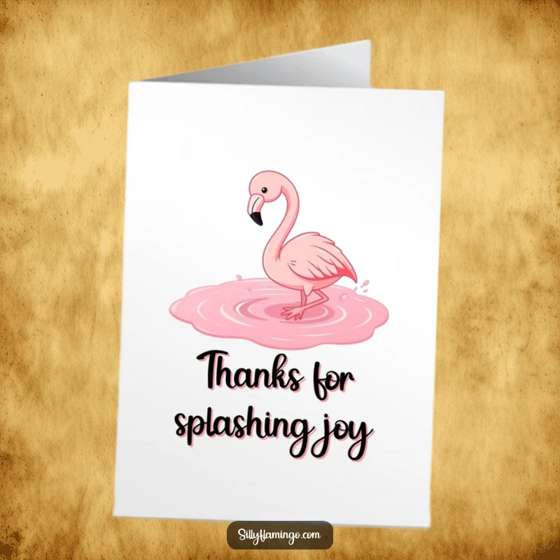 Free Printable Thank You Card: A flamingo happily splashes in pink water, sending thanks in a fun way.