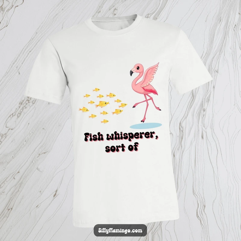 Funny flamingo t-shirt, playfully chasing a school of tiny shimmering fish, showcasing lively bird and fish interaction, ideal for casual wear and gifts.