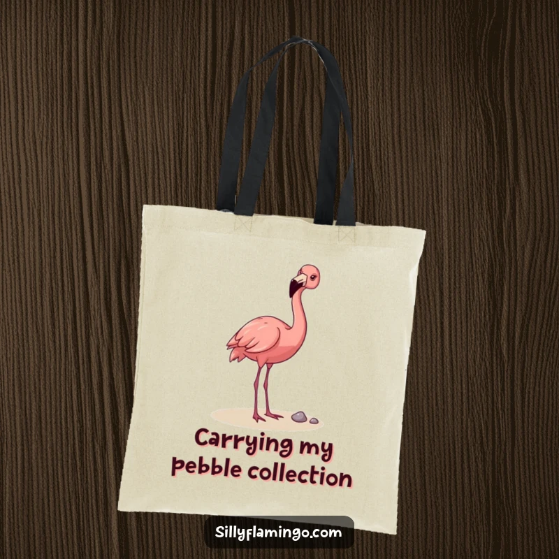 Funny Flamingo Tote Bag: A happy flamingo playfully tossing a pebble with its beak, designed for carrying essentials with a dose of hilarious charm.