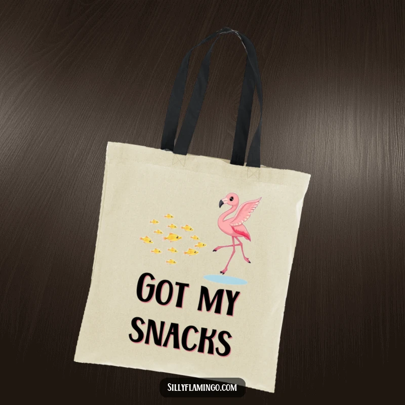 Funny flamingo tote bag, playfully chasing a school of tiny shimmering fish, a whimsical and practical accessory for carrying items with a smile, a great gift.